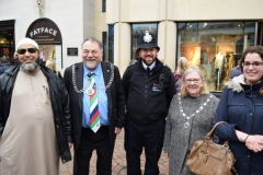 Kingston Mayor, Geoff Austin poses for a group photo with members of the Kingston interfaith Group outside the Bentall shopping centre during a vigil for the victims of Westminster attack