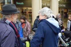 Members from Kingston Interfaith Forum share ideas with the public outside the Bentall Centre during a vigil for the victims of Westminster attack