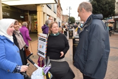Members from Kingston Interfaith Forum exchanges ideas with the public outside the Bentall Centre during a vigil for the victims of the Westminster attack