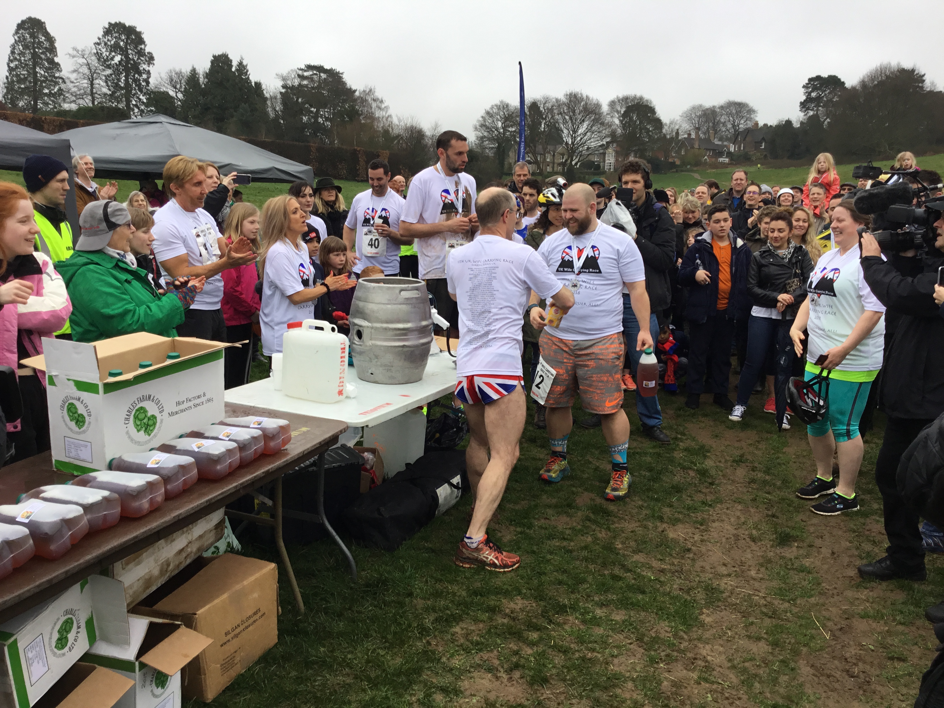 The last-placed finishers receiving their tin of dog food and Pot Noodle