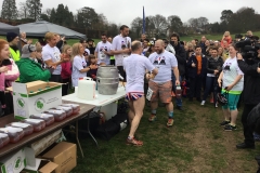 The last-placed finishers receiving their tin of dog food and Pot Noodle
