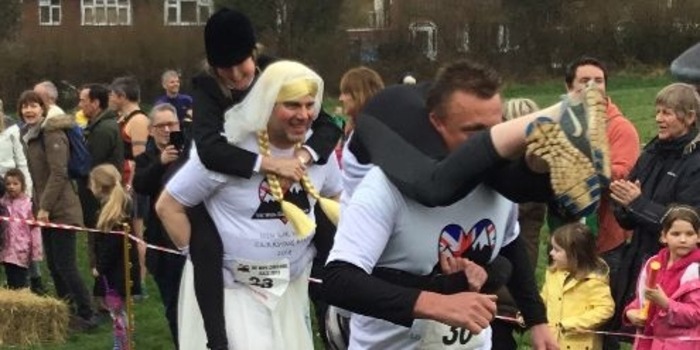 Record numbers compete in the UK Wife Carrying Race in Dorking