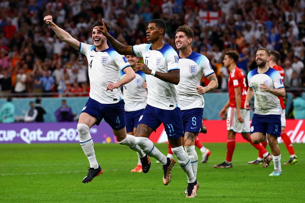 Rashford and Foden secure top spot for England in group B as Wales crash out