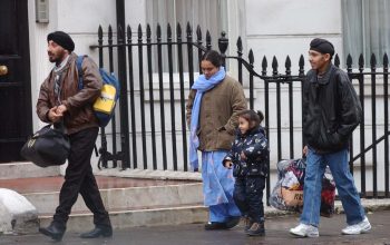 An Afghan family leaving a hotel in London