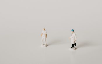 Miniature figures of medical staff.