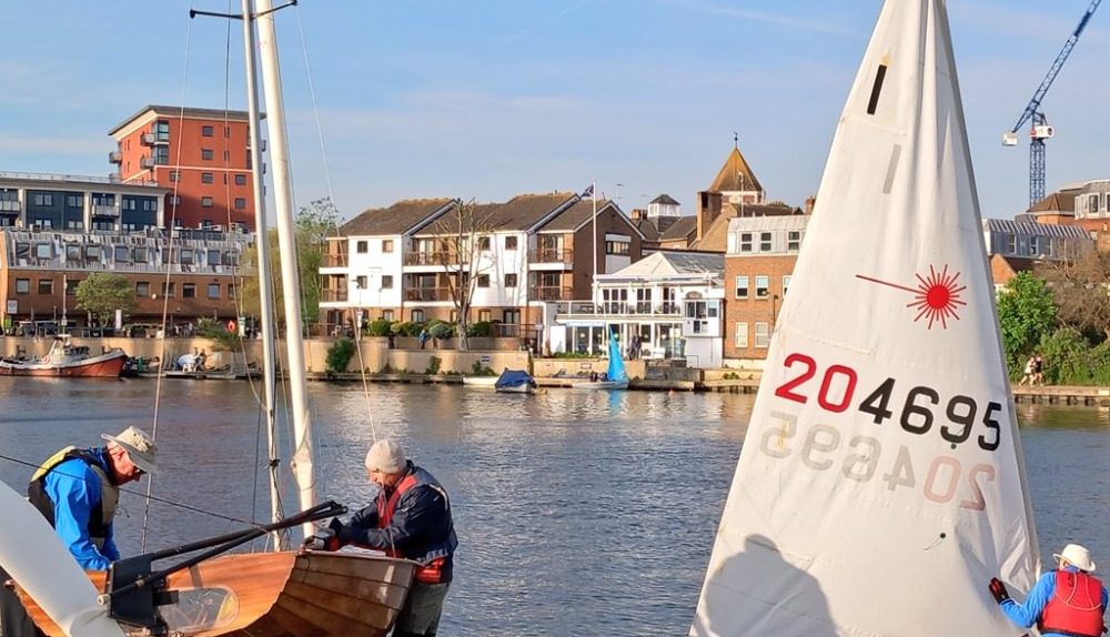 A picture of men preparing to sail on the River Thames at Kingston