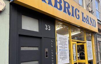 Photo of Fabric Land's shop sign on Old London Road.
